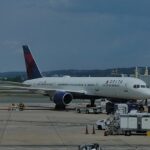 Delta Air Lines Boeing 757 parked at a gate at Ronald Reagan Washington National Airport.